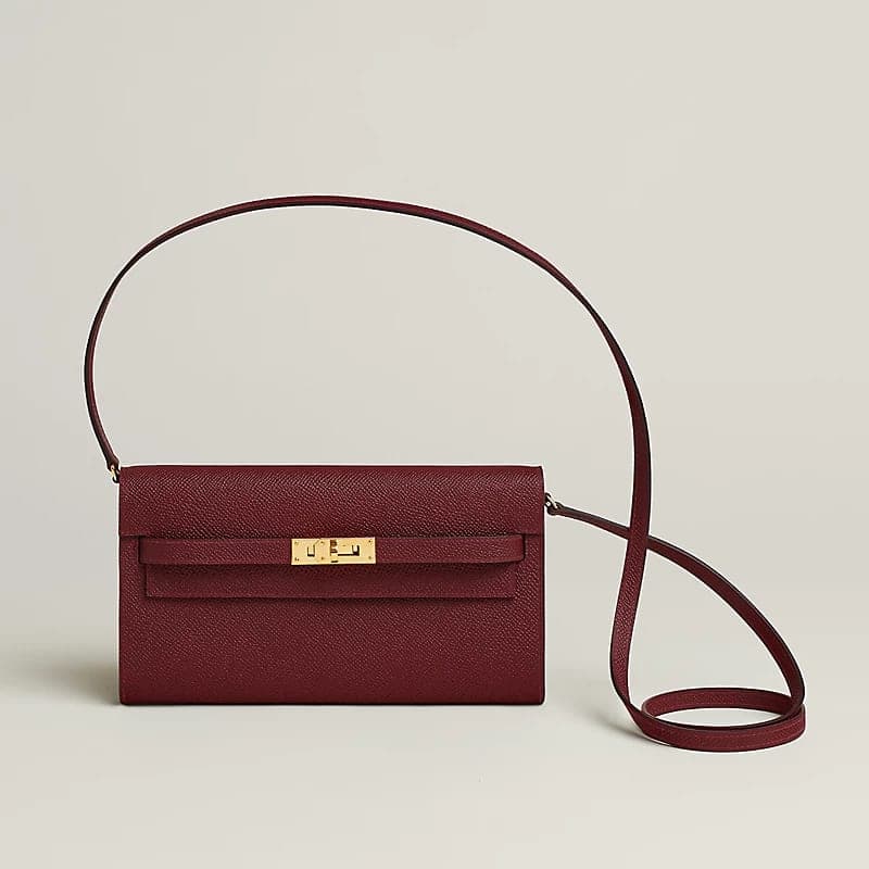 Burgundy Kelly To Go wallet bag on a neutral studio background