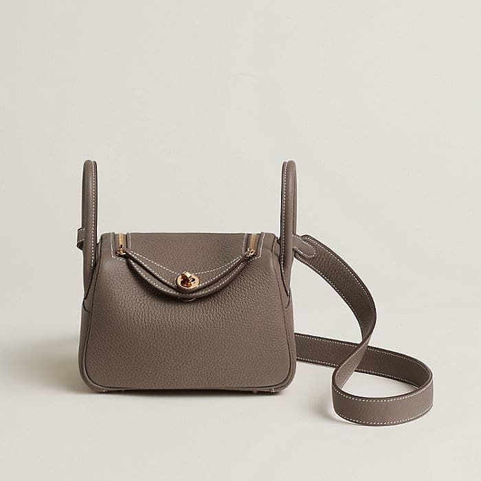Neutral Mini Lindy bag with top handles and shoulder strap