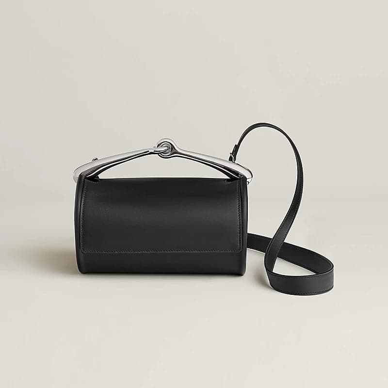 Black Swift leather Maximors bag on a neutral background